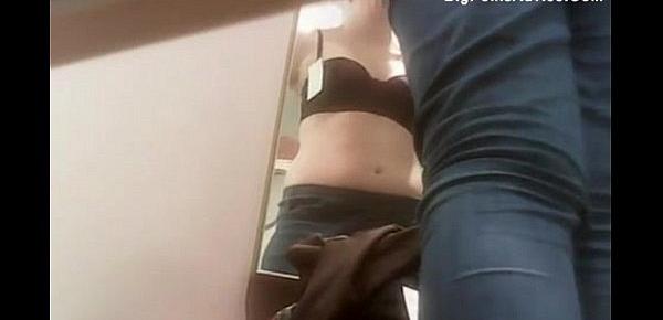  Cute chick trying on clothes in dressing room